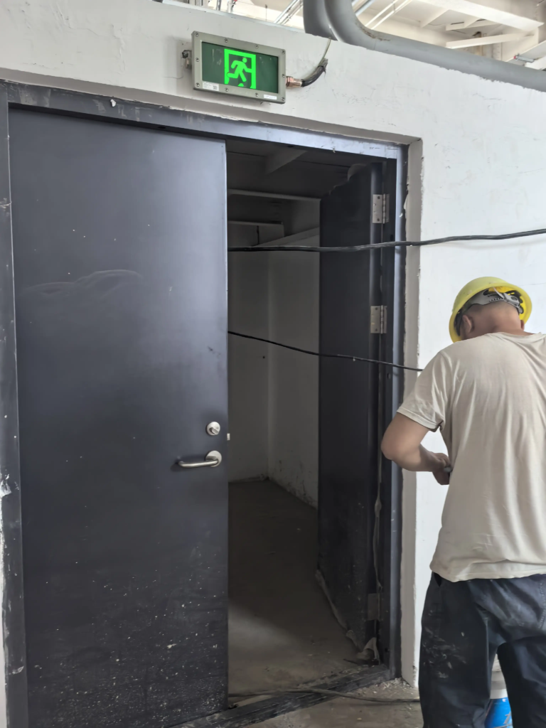 What setup would you recommend for fire doors in high-rise residential building stairwells?
